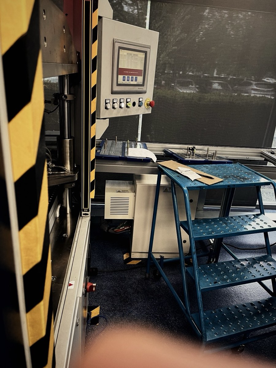 Machine control panel beside a work platform