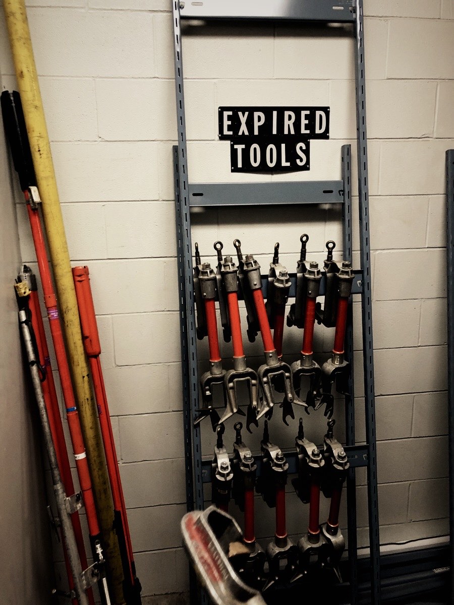 Tool rack labelled Expired Tools, found during a site audit