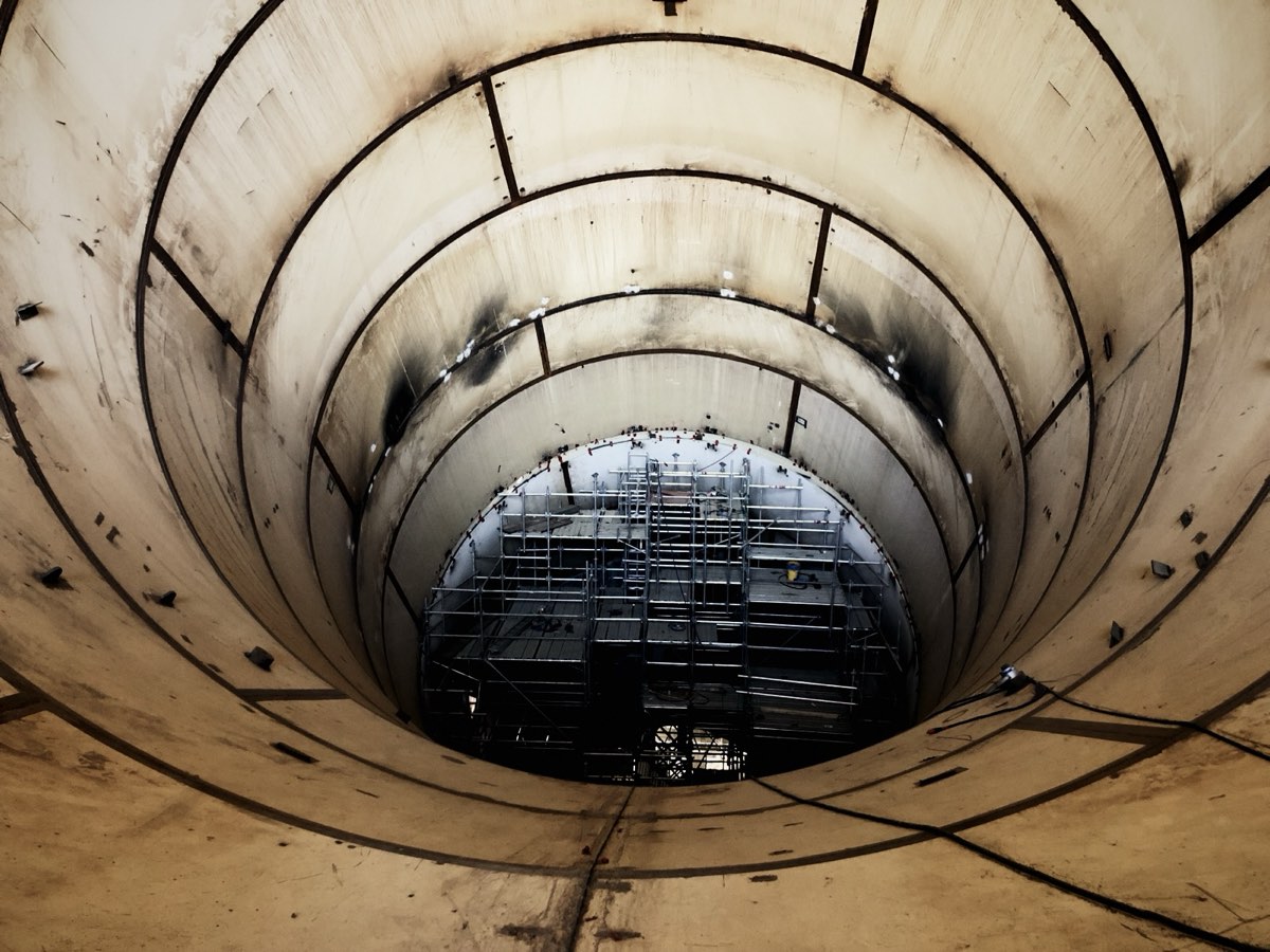 Looking down a deep construction shaft