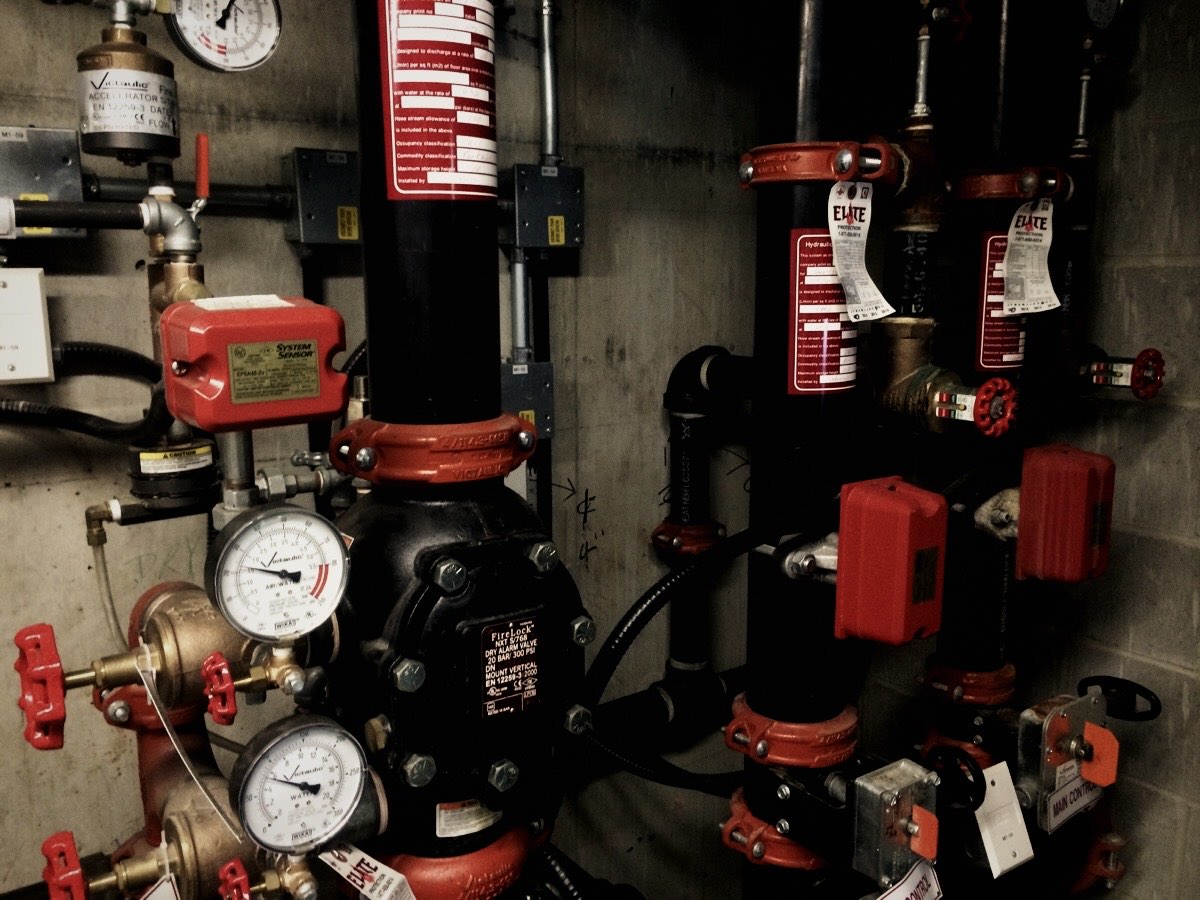 Fire sprinkler valves and gauges during an inspection
